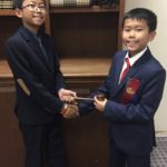 Kam passes the gavel to big brother Kenneth